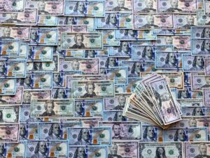Dollar Stabilizes Ahead of Key US Jobs, Inflation, and GDP Data