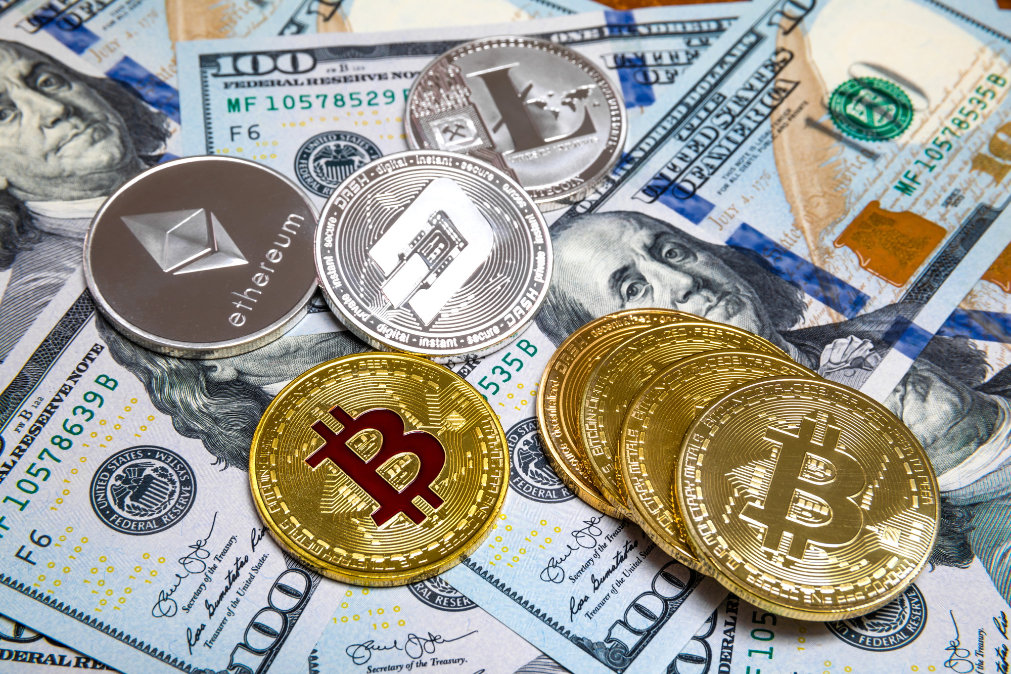 Bitcoin and cryptocurrency on banknotes of one hundred dollars
