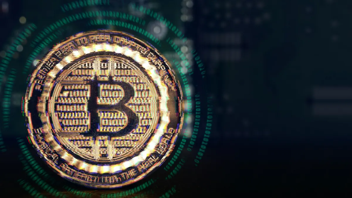 Gold metallic bitcoin coins with a digital glitch effect and glowing binary code in the background