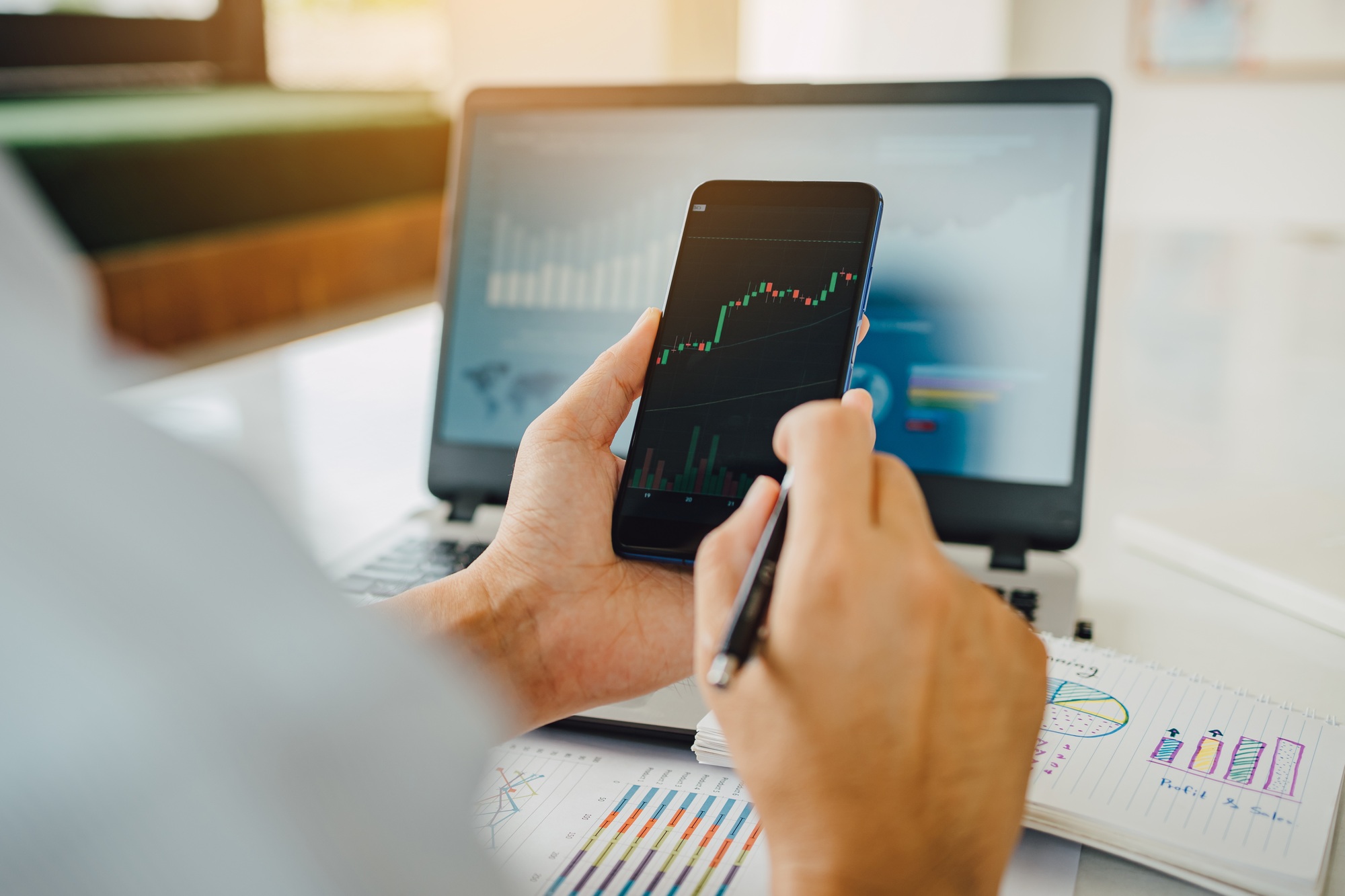 Businessman invest bitcoin price digital chart exchange on smartphone