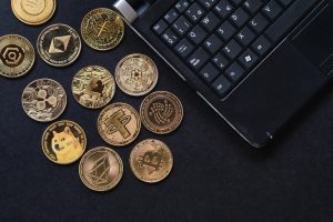 Various cryptocurrencies and laptop